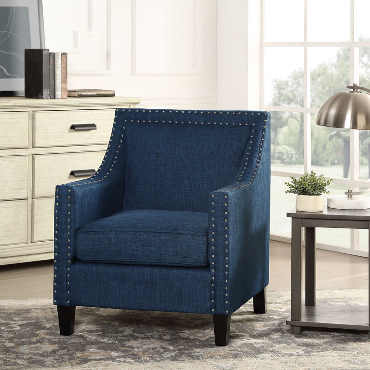 Navy tufted accent outlet chair with nailhead trim